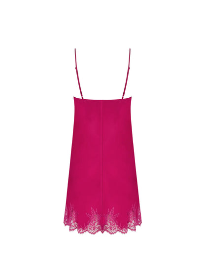 Pink slip dress with lace hem on a white background