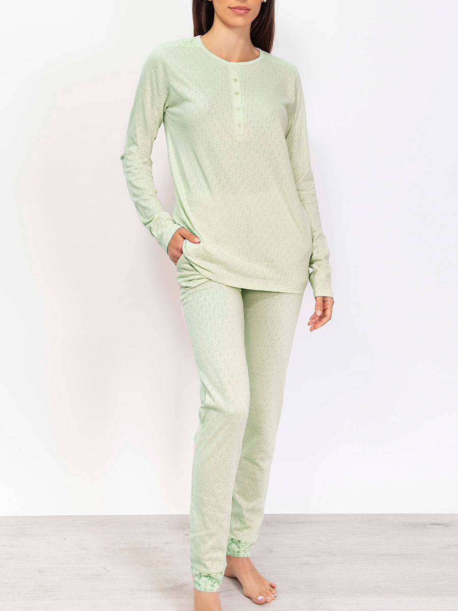 This premium pointelle cotton pajama set is crafted with a soft, subtly-textured fabric. Its long-sleeved top and trousers feature an elegant color palette that strikes a balance between comfort and style. 
