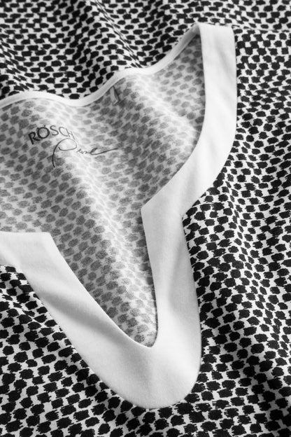 Rösch's Pure collection features a nightgown boasting an ornamental dots print and a fabric blend of cotton and modal for utmost comfort.